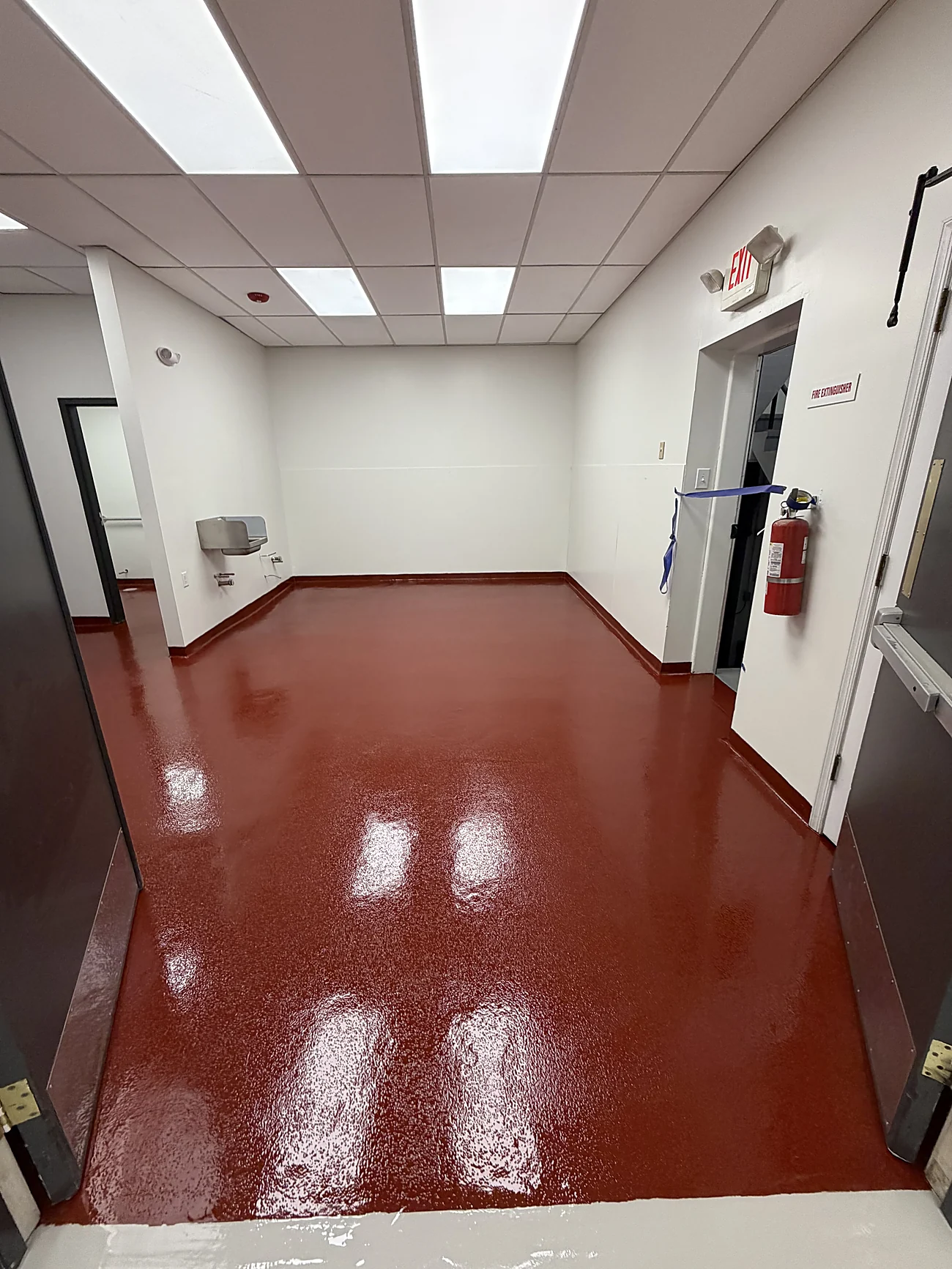 Tile red solid epoxy floor in a commercial room