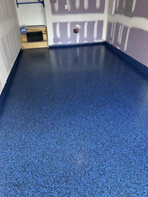 Blue flake epoxy floor with solid border