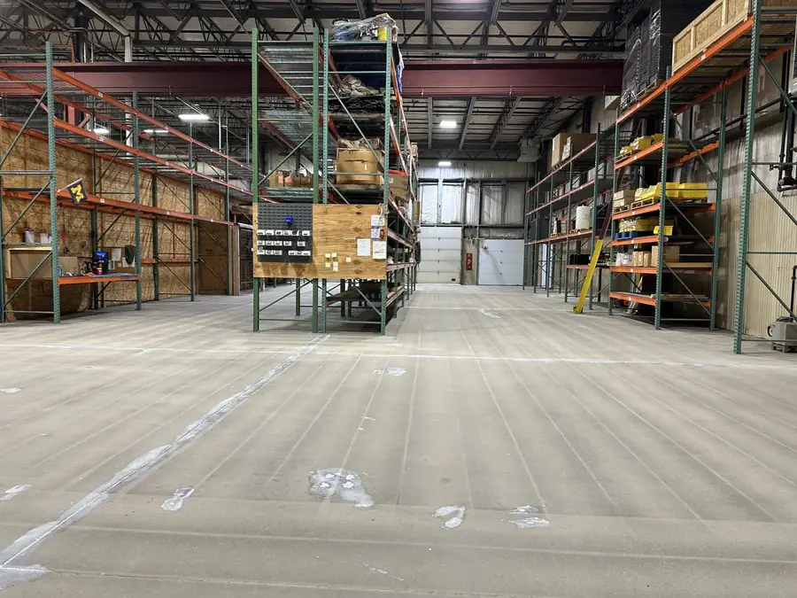 Bare concrete warehouse floor before coating